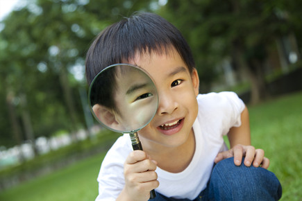 Preschooler with Magnifying Glass