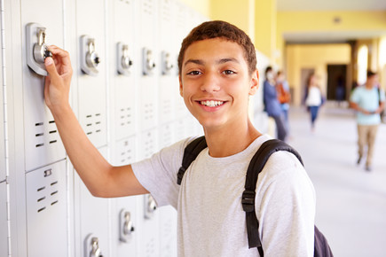 Boy Unlocking School Locker